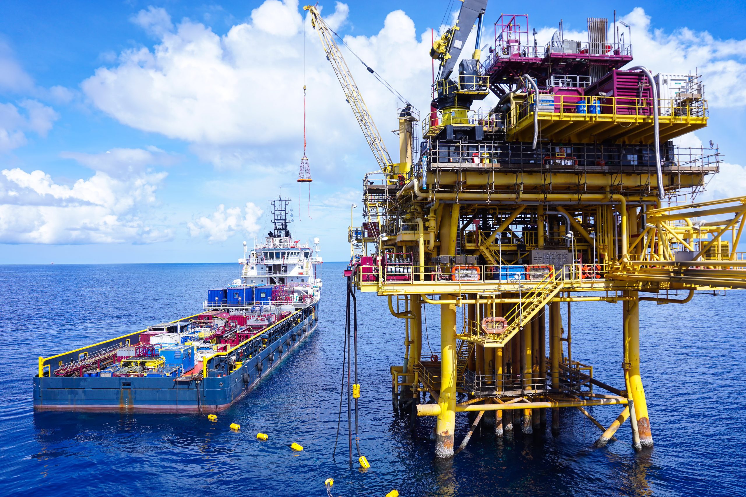 Offshore oil and gas platform in The Middle of The Sea ,Offshore supply boat working at sea ,Thailand