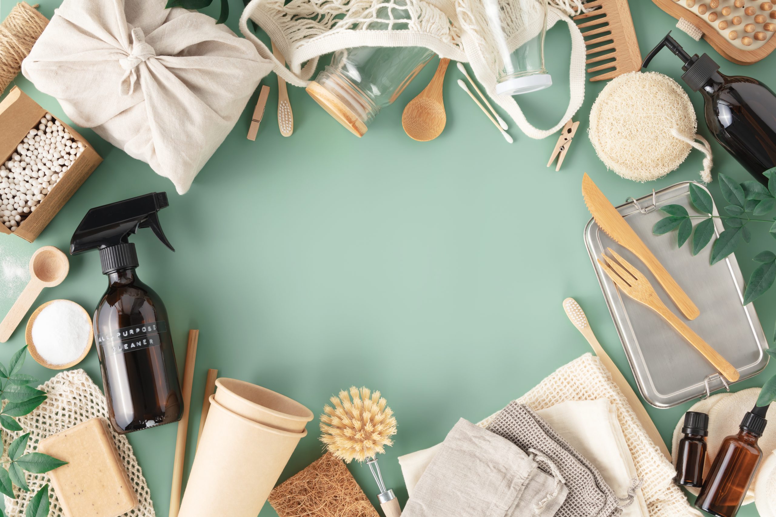 Set of eco-friendly tableware and cleaning products on pastel blue background, flat lay stop plastic pollution Set of eco-friendly tableware and cleaning products on pastel blue background, flat lay stop plastic pollution